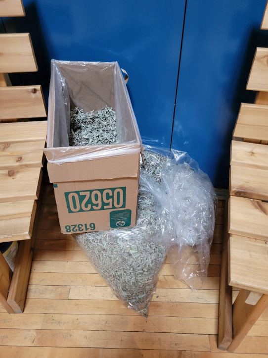 Photo of a box and bag full of Sage used for ceremonies at Pê Sâkâstêw Centre.
