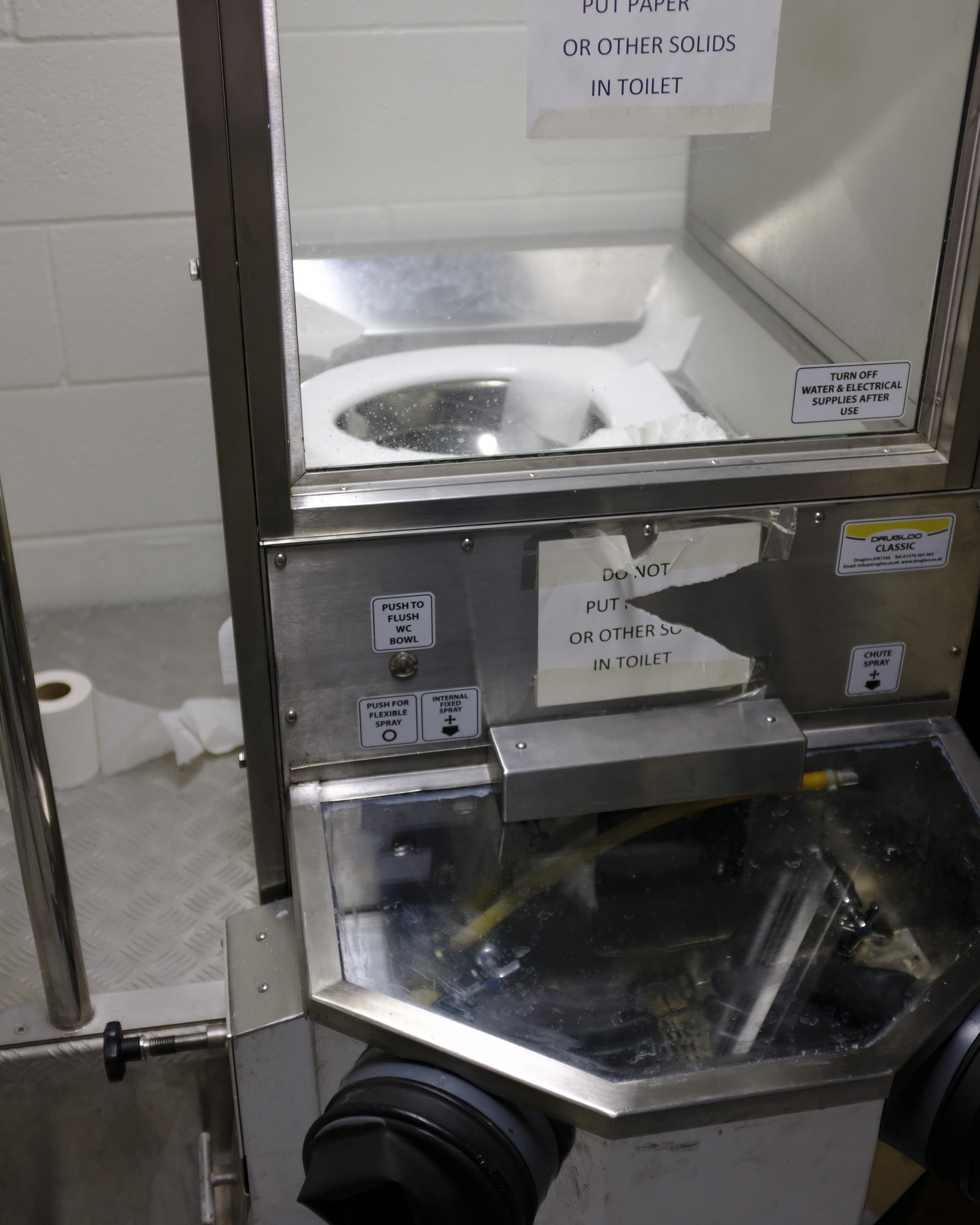 Photos of dry cell toilets at four institutions: Donnacona, Edmonton, Grande Cache, and Stony Mountain.